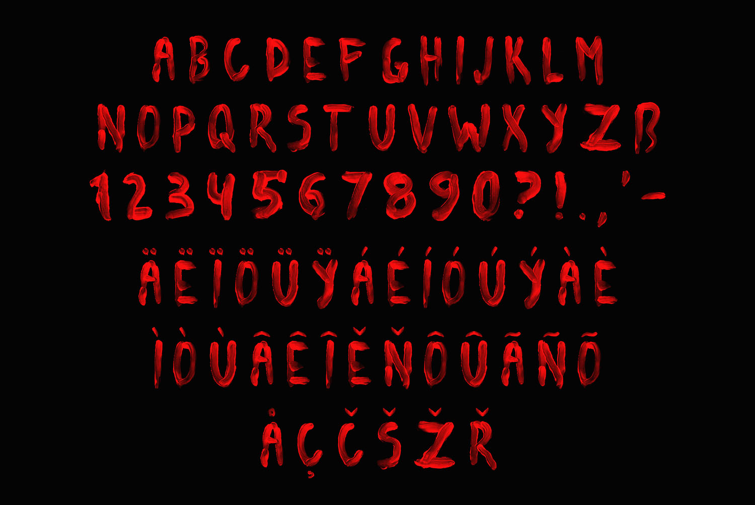 Blood Font alphabet on black Blood Font alphabet, numbers and punctuation glowing scarlet against a black background
