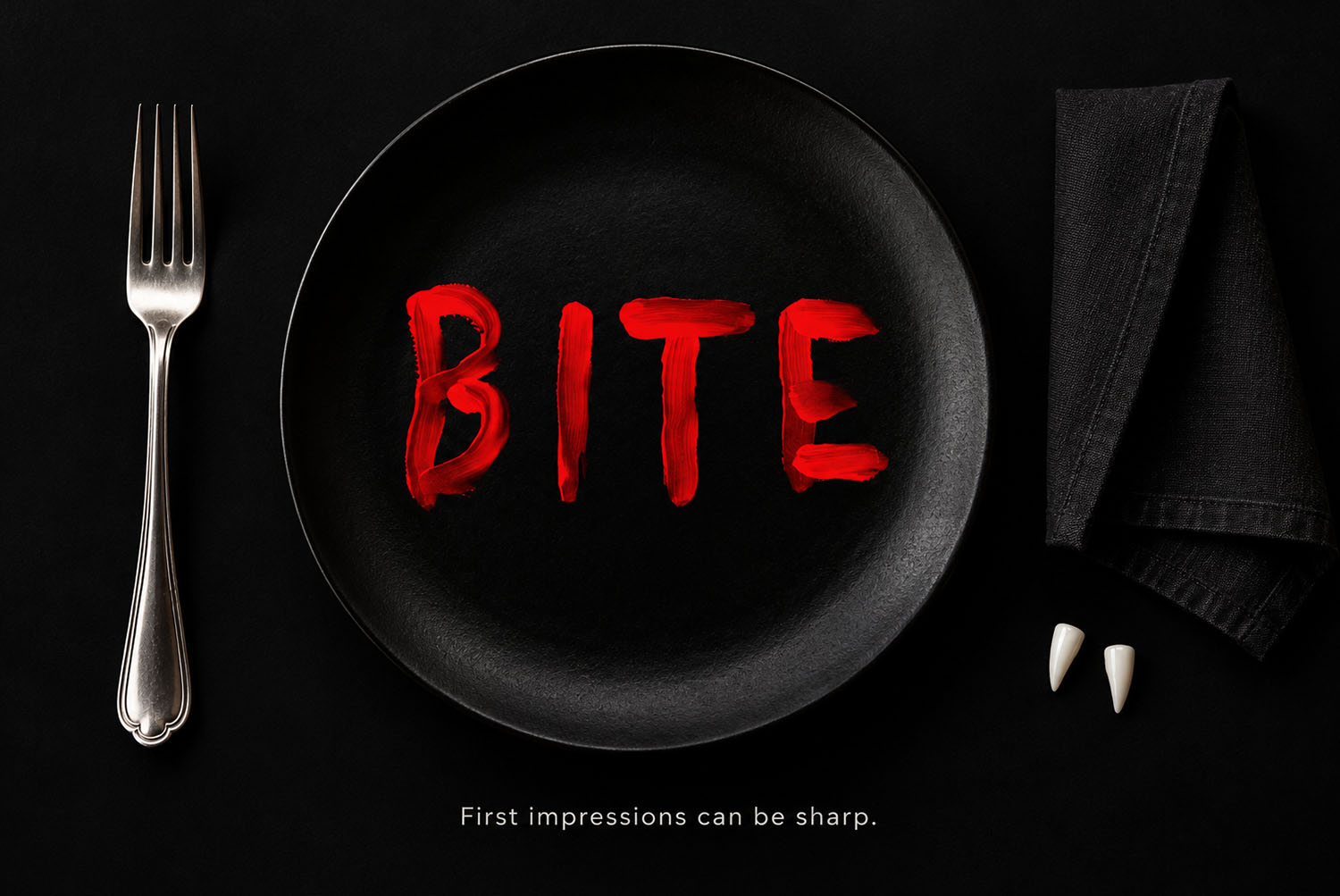 Blood Font on a dinner plate Black dinner plate with the word BITE painted in the Blood Font beside a fork and knife