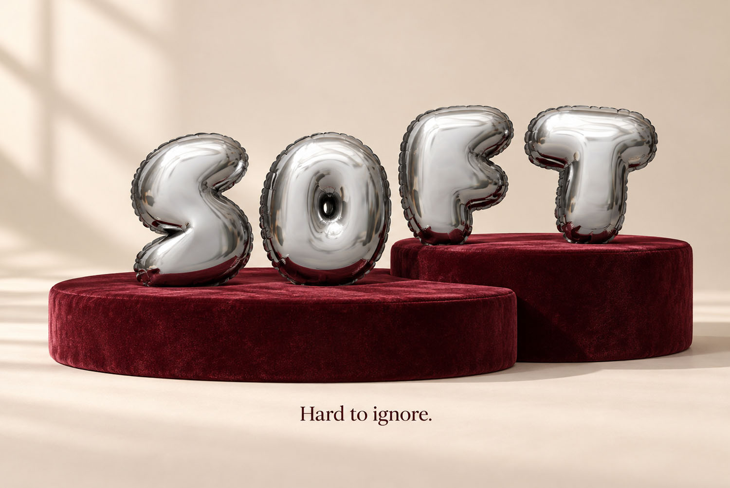 Chrome Balloon Font on velvet podiums The word SOFT in the Chrome Balloon Font standing on dark red velvet podiums