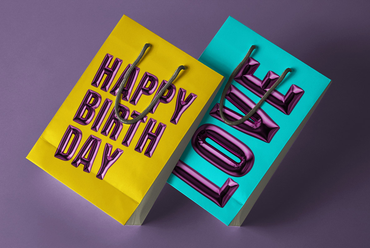 Happy Birthday Font gift bag mockup Yellow and turquoise gift bags lettered in the Happy Birthday Font