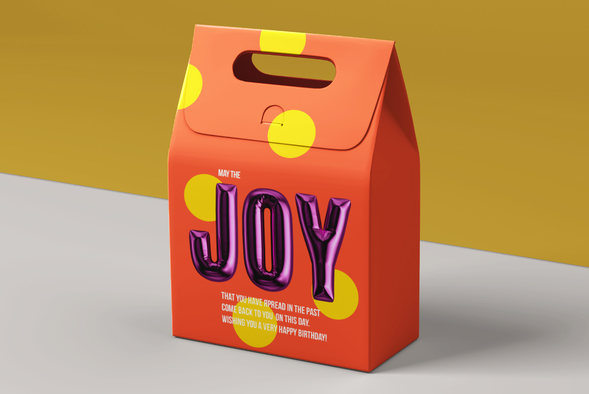 Happy Birthday Font packaging mockup Orange gift box on a gold ground labelled in the Happy Birthday Font
