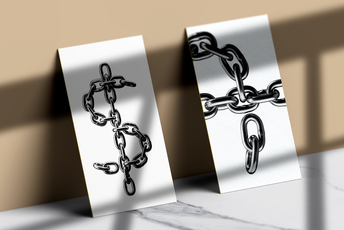 Silver Chain Font cards Silver Chain Font letters shown on a pair of white business cards