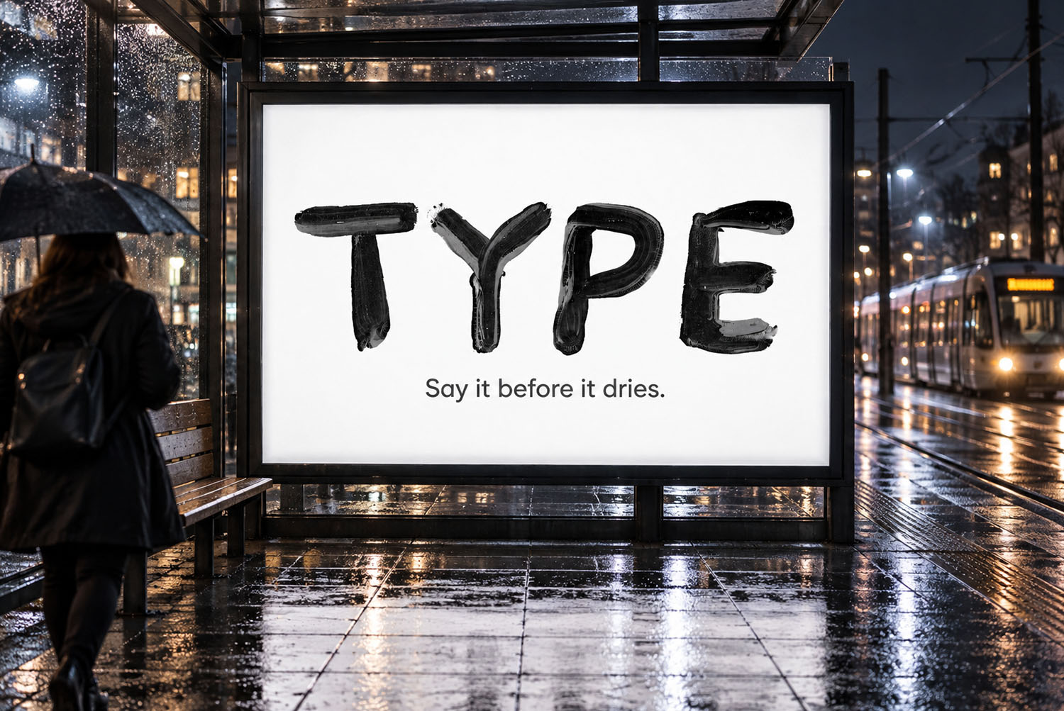 Billboard set in the Black Paint Font Rainy street billboard reading TYPE in the Black Paint Font