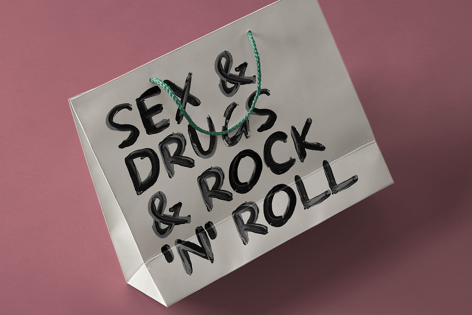 Paper bag printed with the Black Paint Font Paper bag carrying a painted line in the Black Paint Font