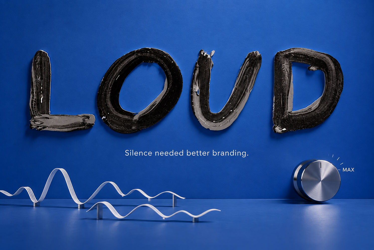 The word LOUD in the Black Paint Font The word LOUD set in the Black Paint Font on a blue wall