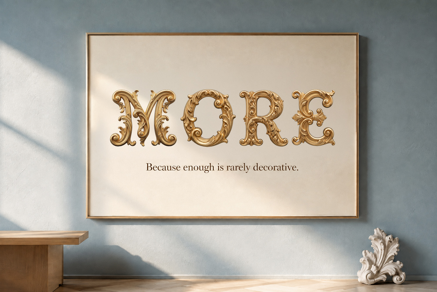 Golden Rococo Font – MORE Poster Mockup MORE written in ornate gold Rococo lettering on a framed wall poster