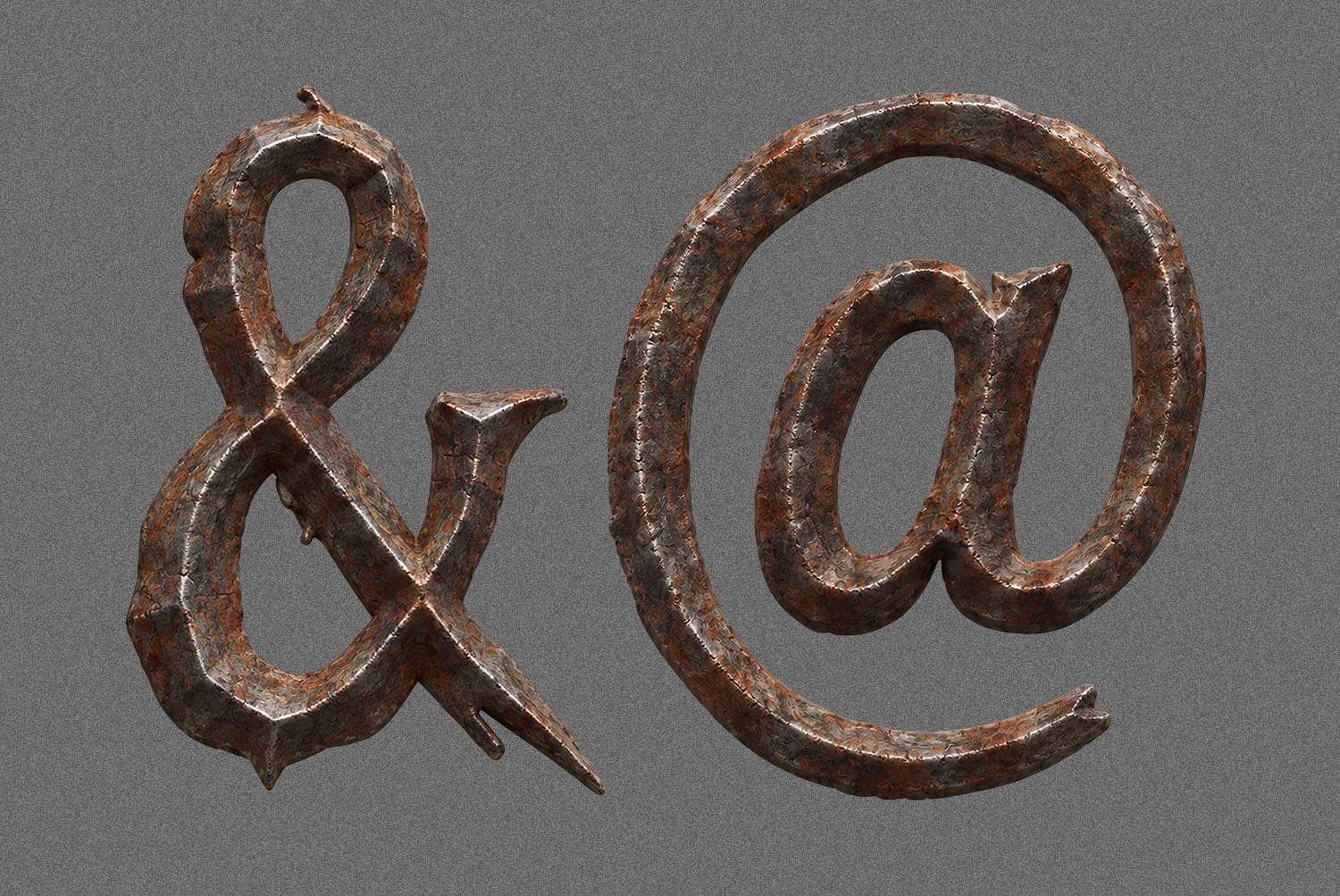 Ampersand and at sign of the Gothic Rust Font Ampersand and at sign of the Gothic Rust Font in pitted rusty metal on grey