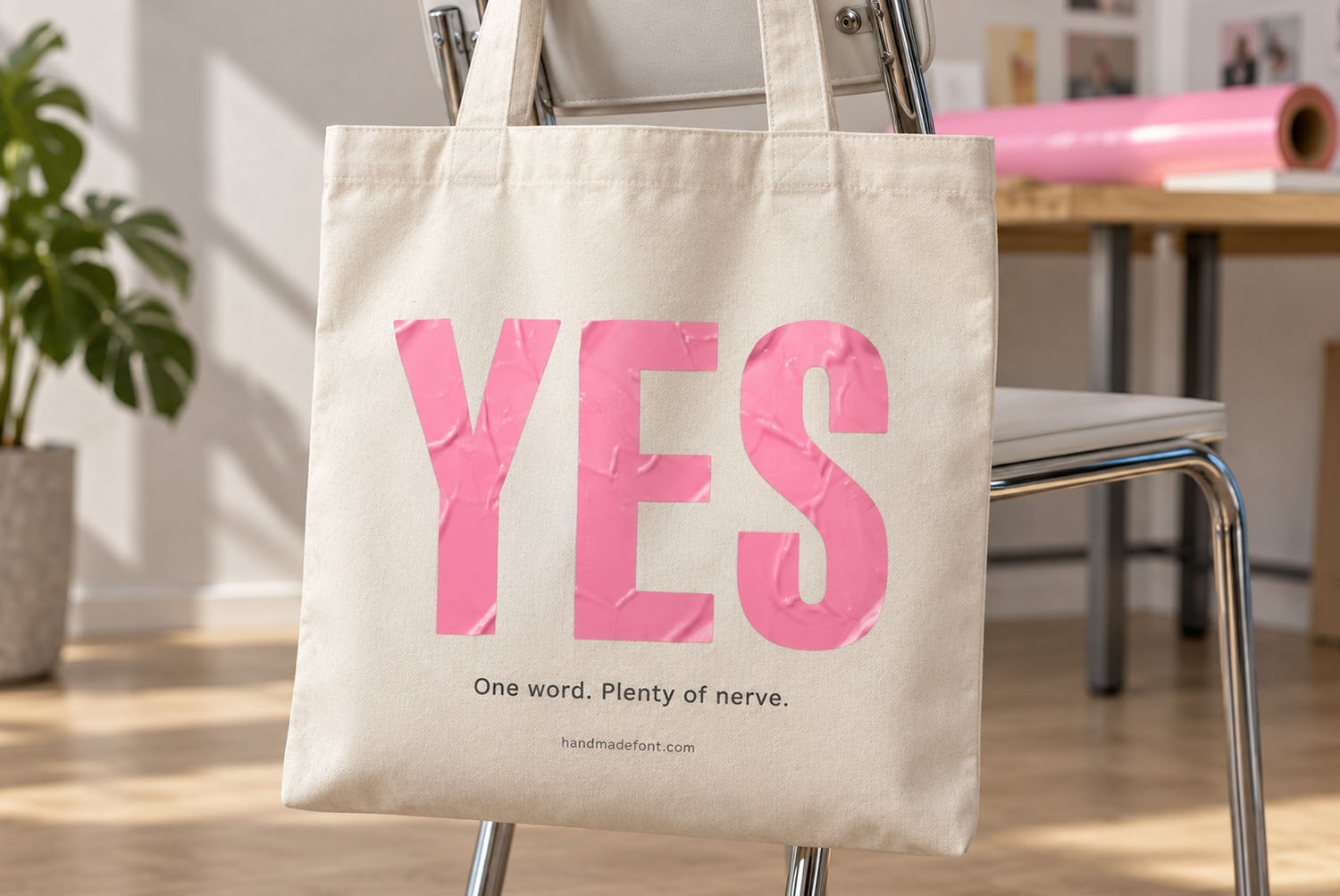 Pink Sticker Font Tote Bag Canvas tote bag carrying the word YES in the Pink Sticker Font
