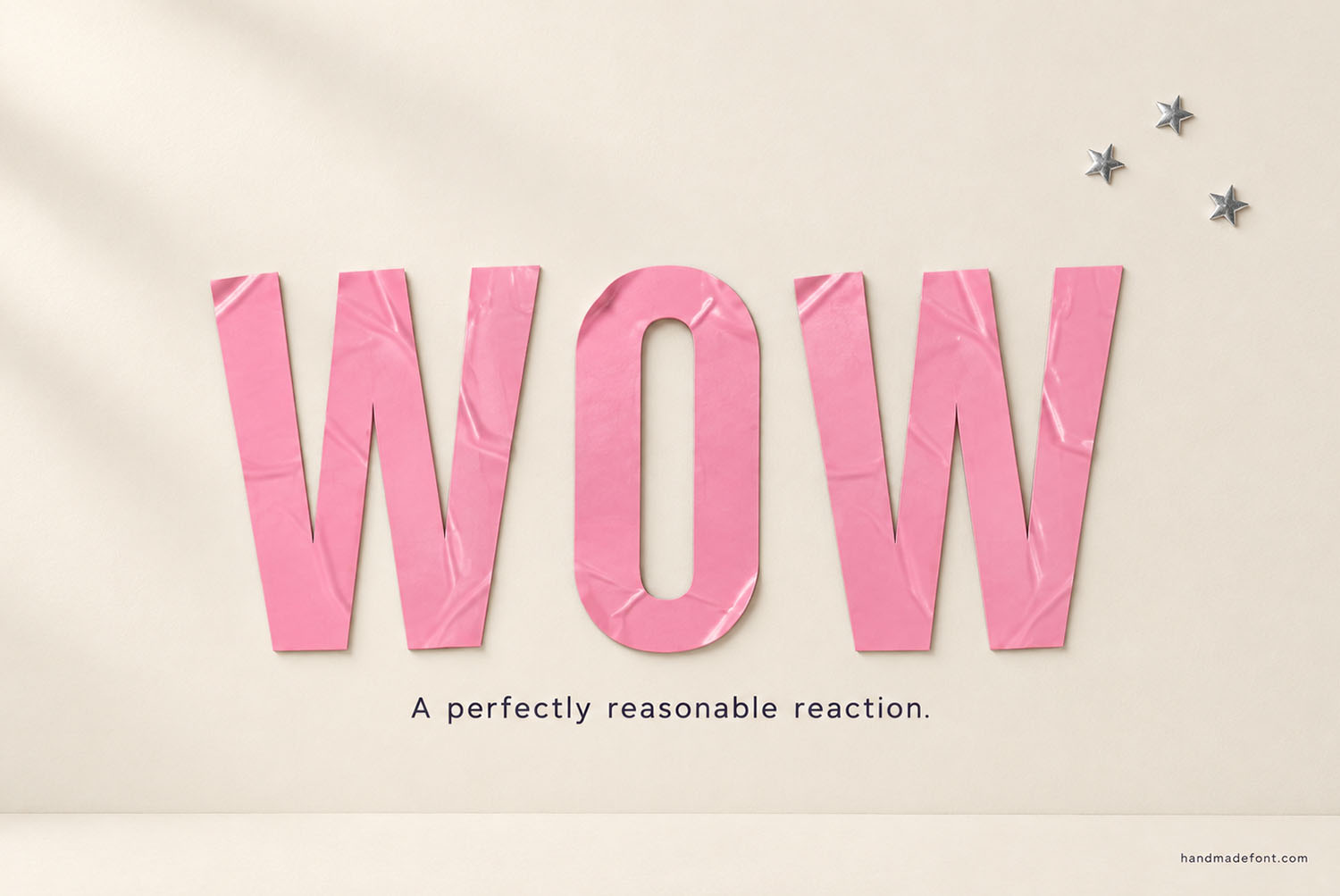 Pink Sticker Font Wow Lettering The word WOW in the Pink Sticker Font on a cream wall beside small star stickers