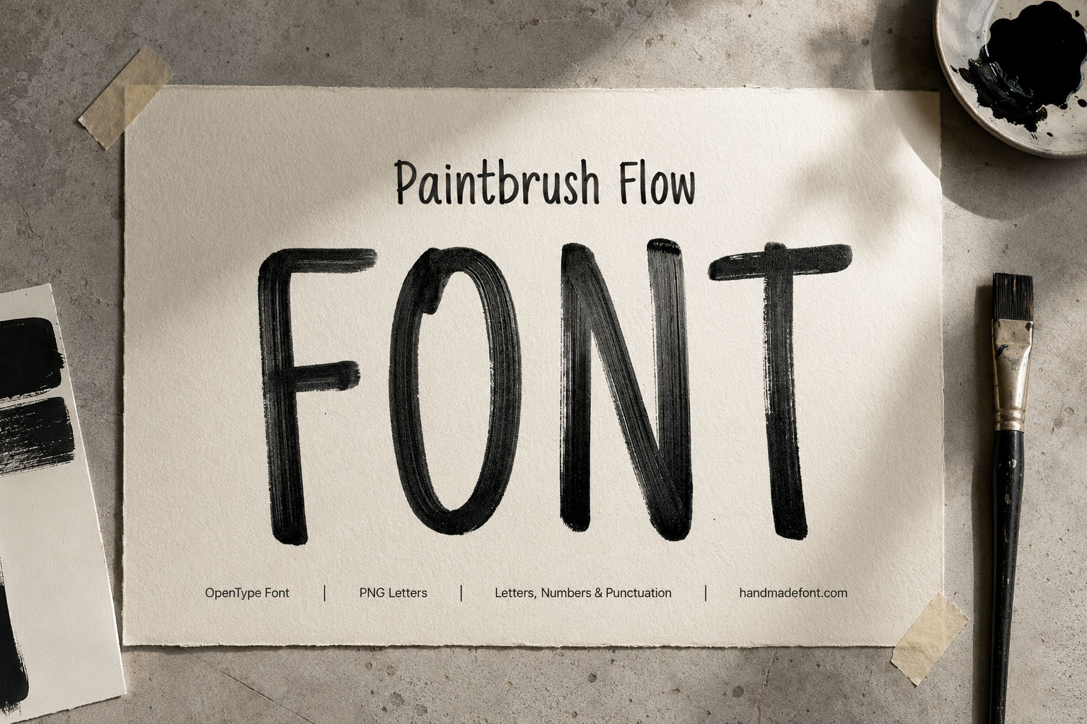 Paintbrush Flow Font black ink brush letters on textured watercolour paper